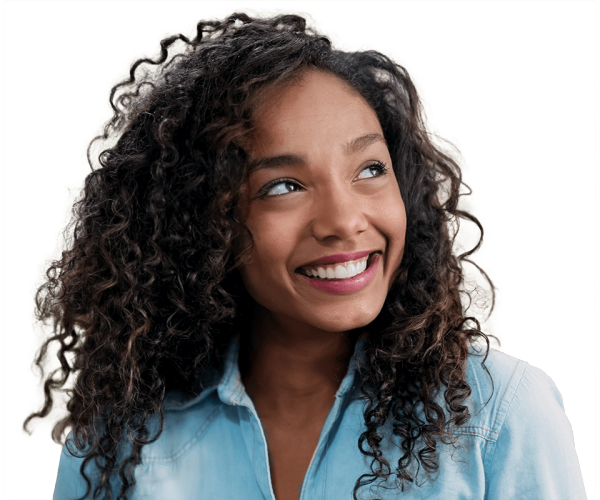 Woman with curly hair in denim shirt looking up