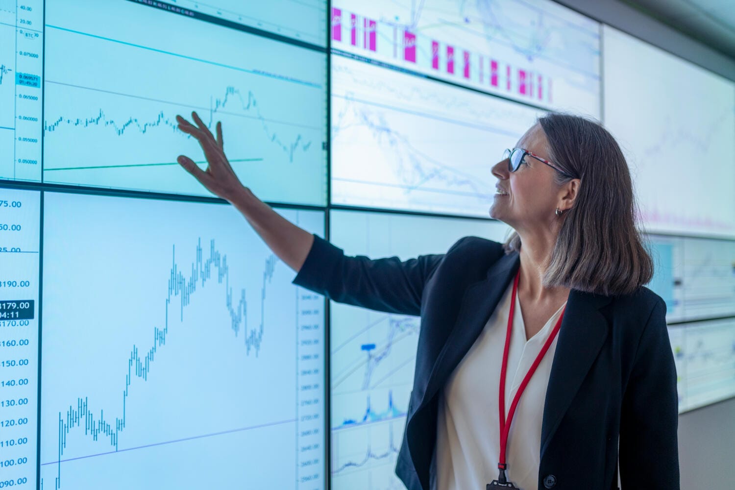 Businesswoman looking at data on screen