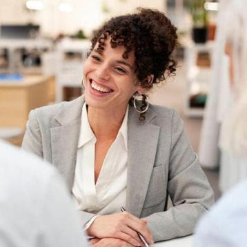Smiling financial advisor meeting with clients