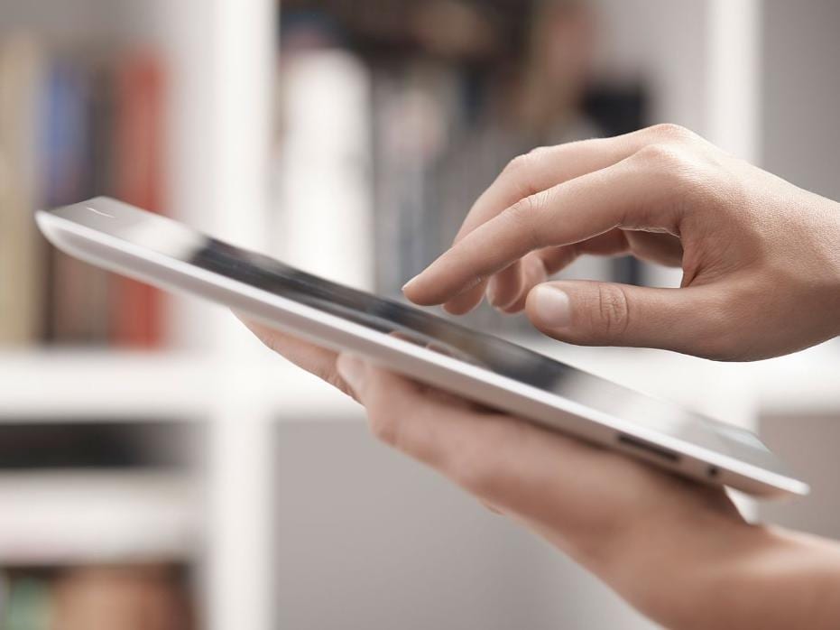 Finger pointing at iPad