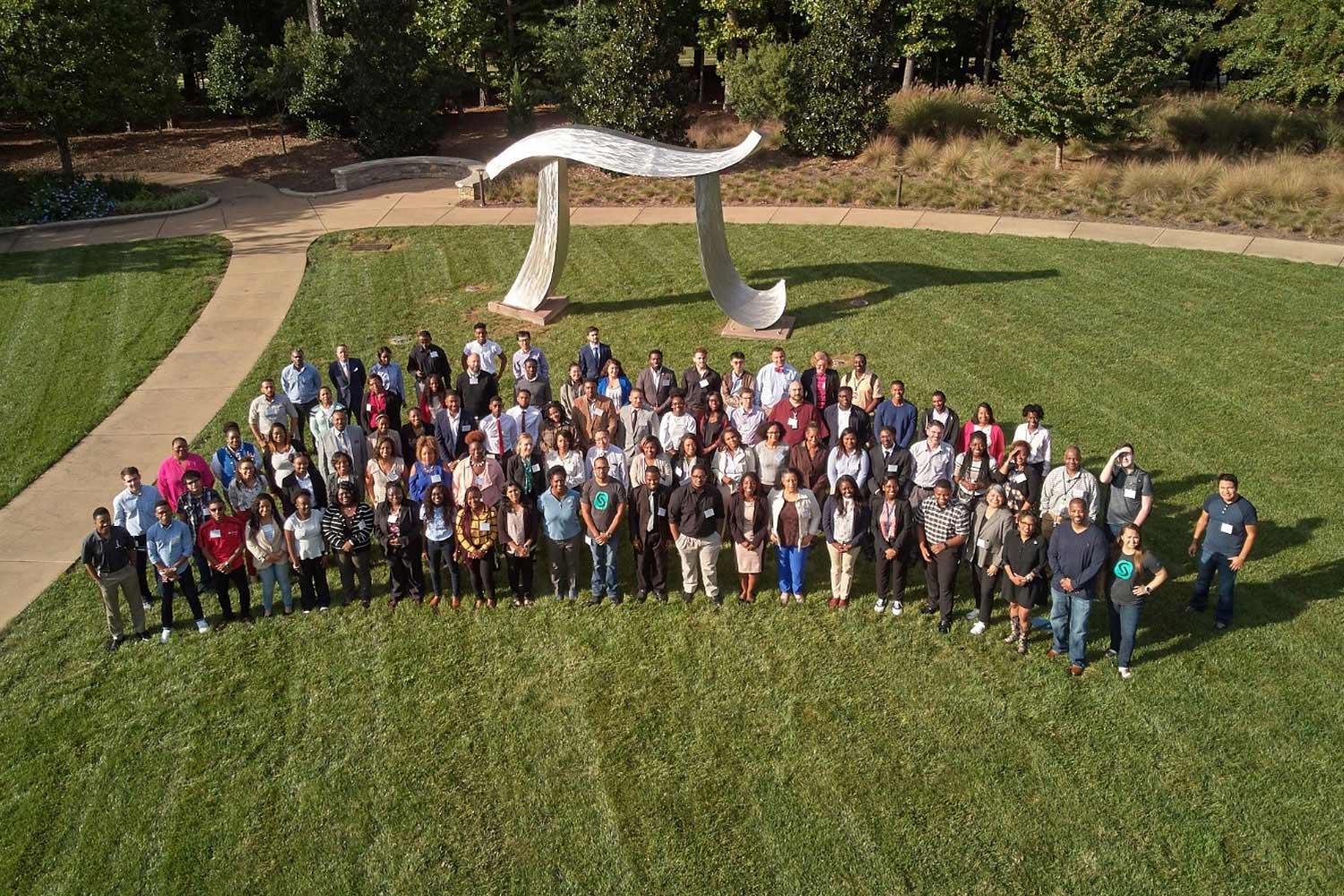 HBCU Initiatives at SAS Headquarters Group of SAS employees and interns on SAS headquarters lawn with large Pi sculpture behind them