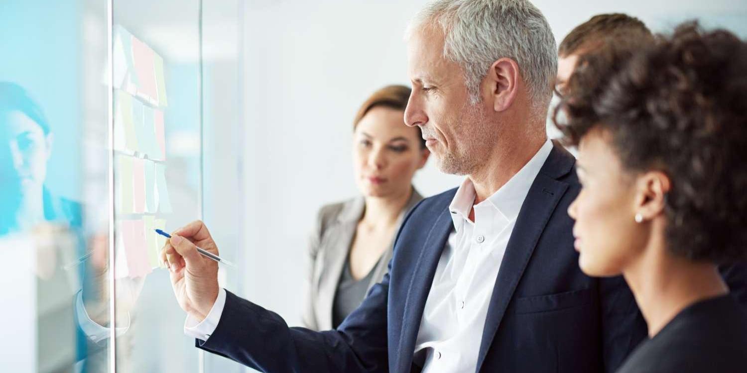 Business man explaining on a screen